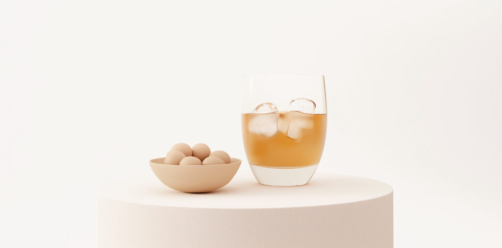 vaso de vermut y unas olivas